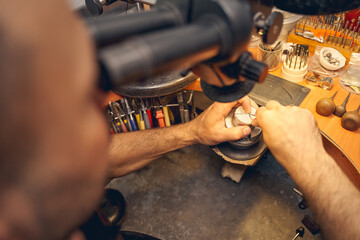 Skilled worker working with an optical device