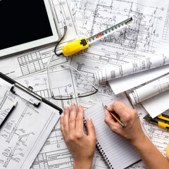 architect design working drawing sketch plans blueprints and making architectural construction...