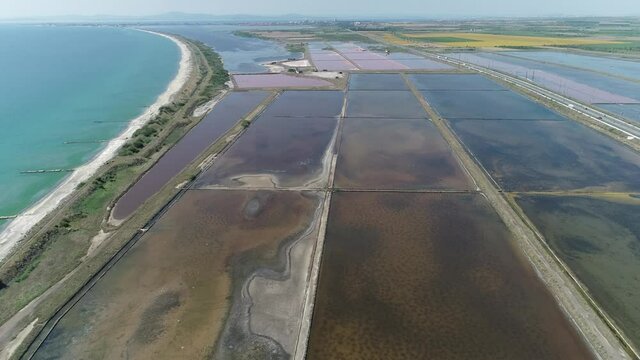Amazing drone aerial landscape of the beautiful salt ponds, near the beach