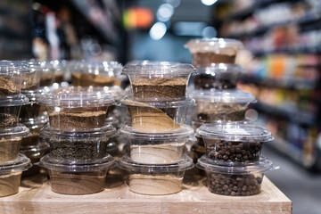 various spices and herbs packed in small transparent plastic boxes