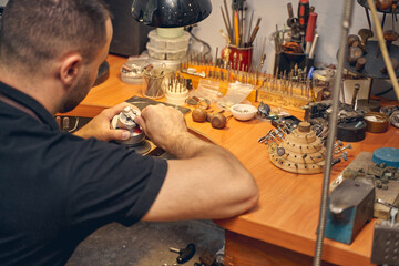 Male jeweler involved in the creative process