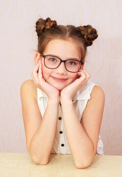 Cute little girl child preteen in eyeglasses education, school and vision concept isolated