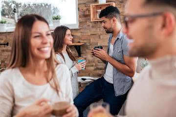 Friends in the morning during a winter vacation, focus on the ba