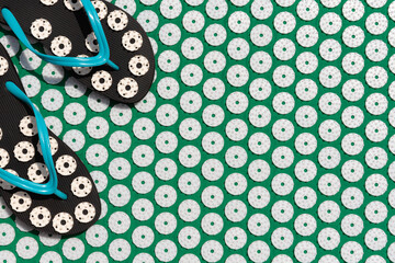 Massage mat for acupuncture and swimming pool flip- flops for spine.