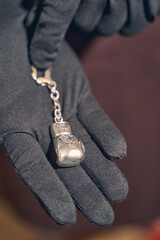 Master holding a jewelry item in his hand