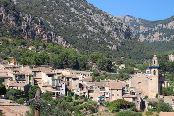 Fototapeta na wymiar View of the city of Valdemossa and the mountains against the blue sky, Majorca. Spain.
