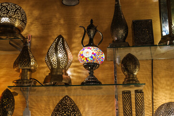 shelf in the store with table lamps in the national Moroccan style