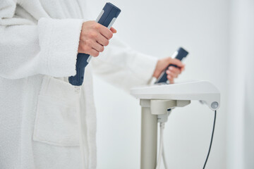 Female putting her hands on the medicine modern machine