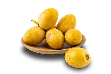 Bunch of freshly harvested date fruit in a wooden plate on white background with clipping path.