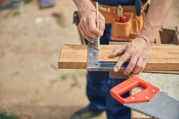 Caucasian male worker drawing a straight line
