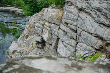 a large sheer cliff above the water