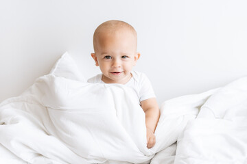 baby boy in white blanket