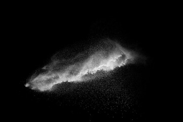Naklejka na ściany i meble White talcume powder explosion on black background. White dust particles splash.