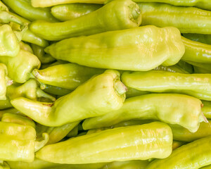 colorful green peppers top view closeup, natural background