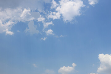 White clouds against blue sky background