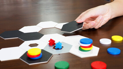 Fototapeta na wymiar people play board game table top abstract strategy business plan design selected focus