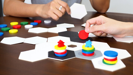 people play board game table top abstract strategy business plan design selected focus - 369016814
