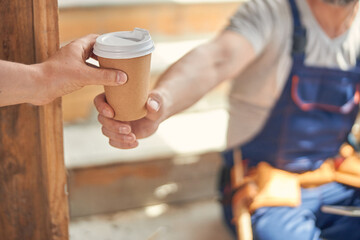 Two builders having a coffee break together