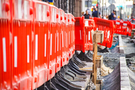 Road construction works in the city street. A road construction hinders traffic in a city. Selective focus