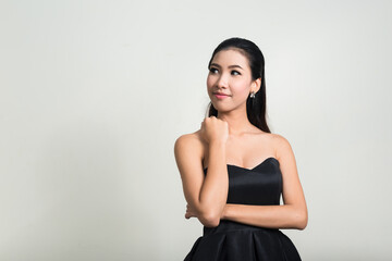 Obraz premium Portrait of young beautiful Asian businesswoman against white background
