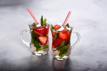 Refreshing Ice Cold Strawberry Lemonade on a old wooden table