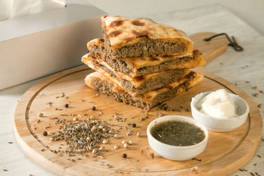 Stuffed qeema minced meat naan with herbs and spices and white butter