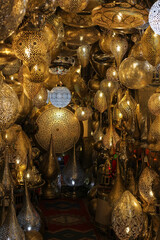 A shop with traditional Moroccan lamps in the Souk Central market in Marrakech. Morocco.