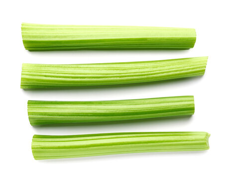 Fresh celery sticks top view isolated on white background