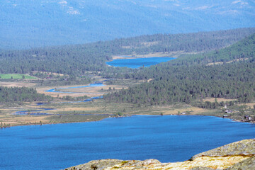 Furusjoen lake and cabins in Rondane national park in Norway during day and sunny weather....