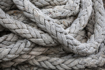 Fototapeta na wymiar Closeup view of fisherman's rope piled in harbour of Clovelly, Devon UK