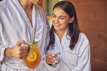Happy cheerful female near sitting near the man