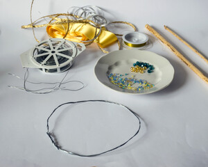 various tools and accessories for making a pearl crown, handmade, spending free time at home, cutlery