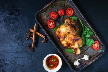 Grilled chicken dishes and dipping sauce From the oven on a black background