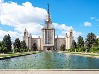 north facade of The Main Building of Moscow University with pool on University Square. Portal inscription: 1949-1953 Moscow State University named after MV Lomonosov