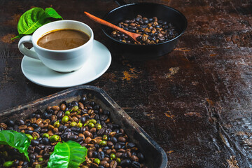 A cup of coffee and coffee beans on a wooden table