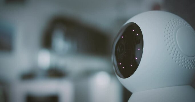 Home security camera scans the home environment with blurred background