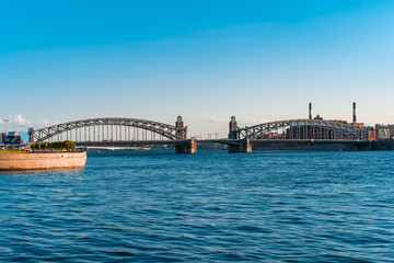 St Petersburg/ Russia - 27 July 2020:  Bolsheokhtinsky bridge from afar at sunset