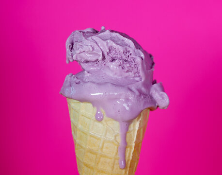 Melting Purple Ice Cream On Purple Background