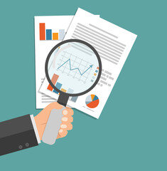 Hand with Magnifying glass data analysis