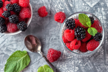 Vegan healthy food. Chia pudding with coconut milk, fresh raspberries and blackberries