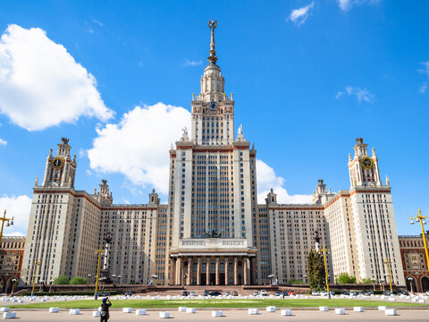 MOSCOW, RUSSIA - MAY 27, 2019: tourist take photo of north facade of The Main Building of Moscow State University (Lomonosov State University of Moscow) from University square in sunny day