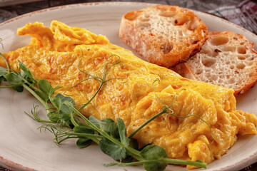 Fresh French omelet with fresh vegetables. Vegetarian food