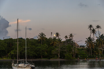  Saint Vincent and the Grenadines, sailboats mooring in Blue Lagoon and moon rise 