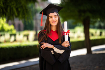 Woman portrait on her graduation day. University. Education, graduation and people concept.
