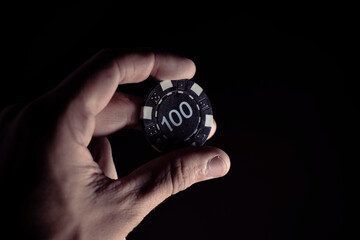 hand holding casino chips