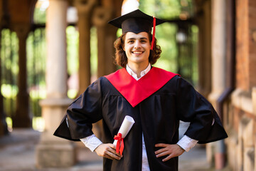 Graduate male student. Graduation concepts. Portrait of young man on graduation day at University....