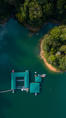Aerial top down view of water chalet resort in Kenyir Lake, Terengganu, Malaysia.