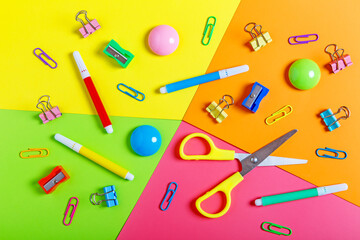 Various school supplies on a colorful background. Back to school concept. Learning and education concept. Stationery store concept. Bright creative school background. Top view, flat lay.