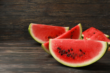 Composition with watermelon slices on wooden background. Summer fruit