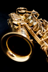 Close up of an alto saxophone isolated on a black background